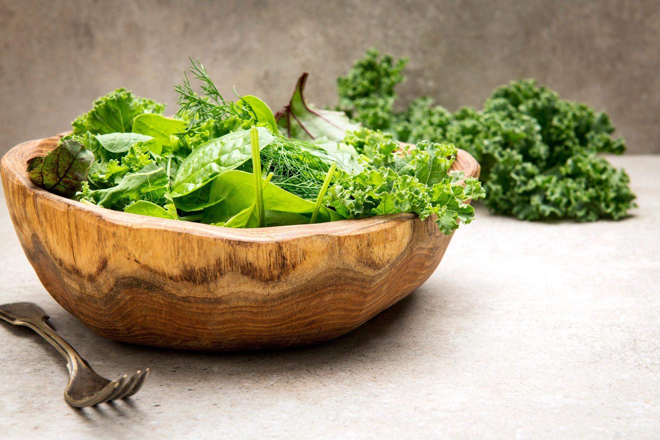 vibrant superfood greens in bowl with herbs