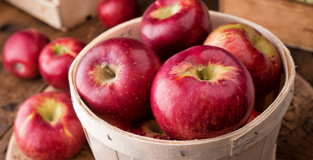 Basket of fresh red apples with a natural shine.